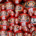 red-and-white daruma dolls