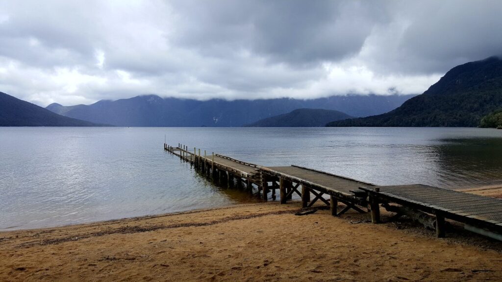 brown wooden dock on sea during daytime