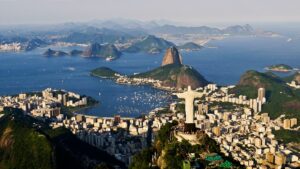 an aerial view of a city and a body of water