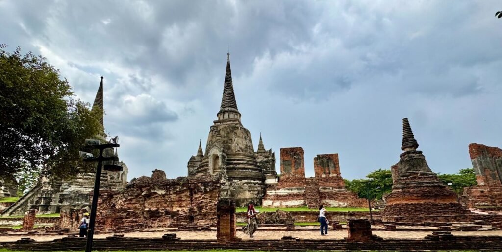 Ancient temple ruins under a cloudy sky