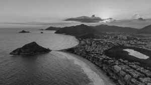 A coastal city nestled between mountains and the sea.