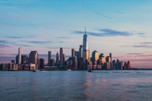 The New York City skyline across the Hudson River from Hoboken at golden hour