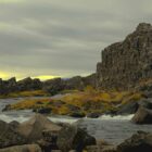 a rocky beach with a sunset