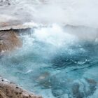 Bubbling hot spring with steam rising