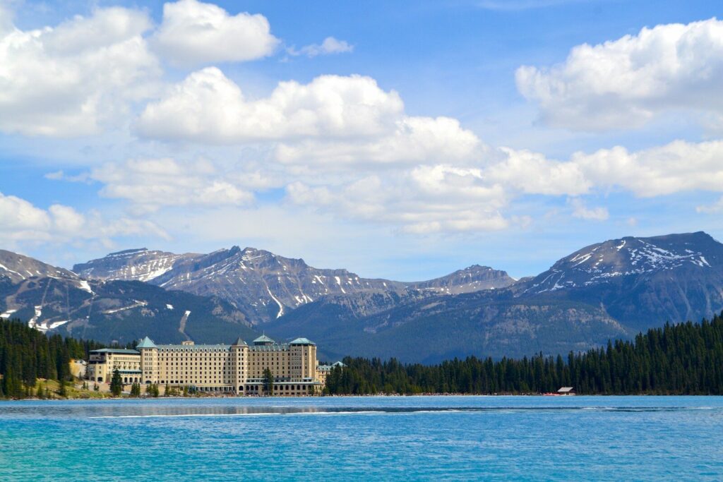 The historic Fairmont lodge on the lakeshore beneath the mountains