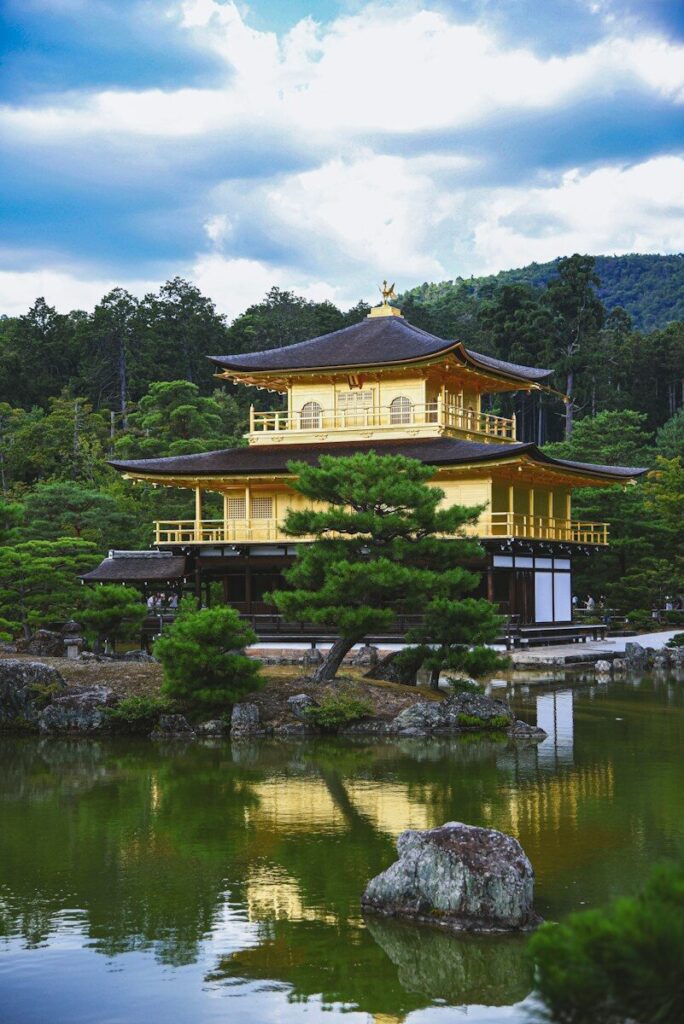 a large building sitting on top of a lush green field