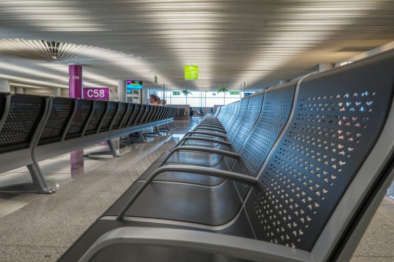 Rows of empty seats in an airport departure area