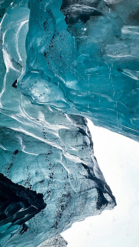 Blue glacier ice inside a natural ice cave in Vatnajökull