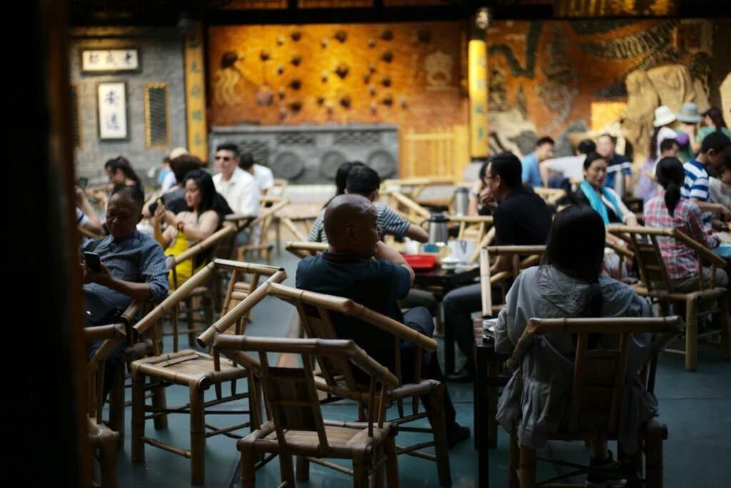People dining in a dimly lit, ornate restaurant