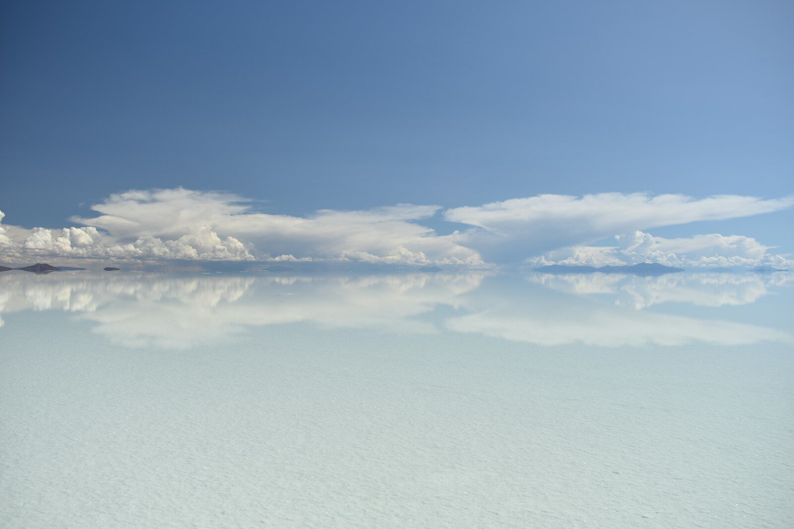Salar de Uyuni salt flat mirroring the sky and clouds after rain